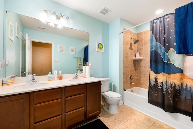 bathroom featuring tile patterned floors, visible vents, and a sink