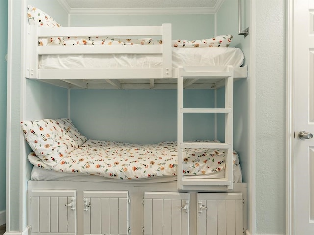 bedroom with ornamental molding