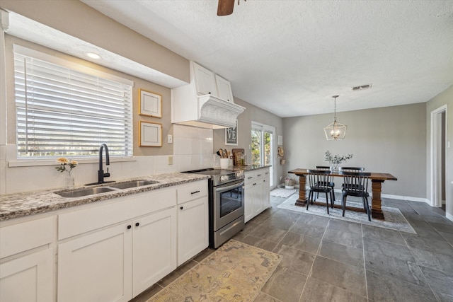 kitchen with a sink, light stone counters, decorative light fixtures, white cabinetry, and stainless steel electric range oven