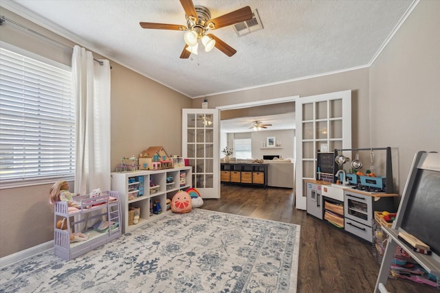 game room with visible vents, crown molding, french doors, wood finished floors, and a textured ceiling