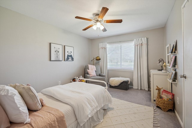 bedroom with baseboards, light carpet, and a ceiling fan