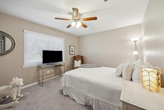 bedroom featuring ceiling fan, baseboards, and carpet floors