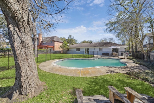 view of pool with a patio, a yard, a fenced backyard, and a fenced in pool