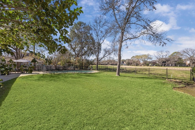 view of yard with a fenced backyard and a fenced in pool