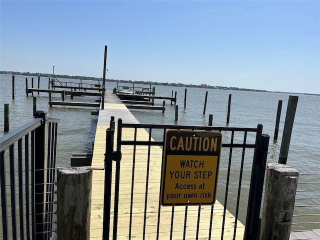 view of dock with a water view and boat lift