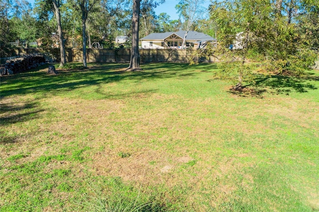 view of yard with fence