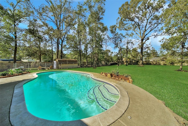 view of swimming pool featuring a yard, a fenced in pool, and a fenced backyard