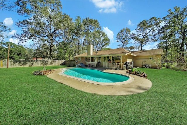 view of pool with a fenced in pool, a lawn, and a fenced backyard