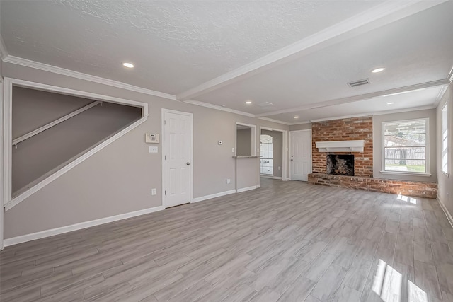 unfurnished living room with visible vents, beamed ceiling, wood finished floors, and ornamental molding