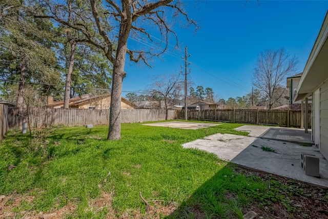 view of yard featuring a patio and a fenced backyard