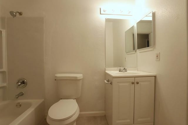 full bathroom with vanity, baseboards, tile patterned flooring, shower / bath combination, and toilet