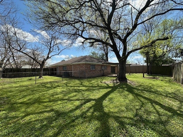 view of yard with a fenced backyard