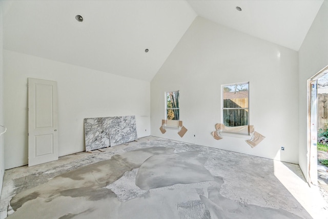 spare room featuring high vaulted ceiling