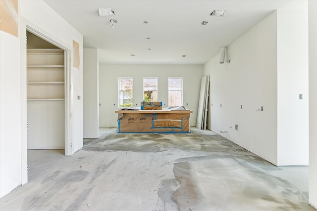 interior space with unfinished concrete floors