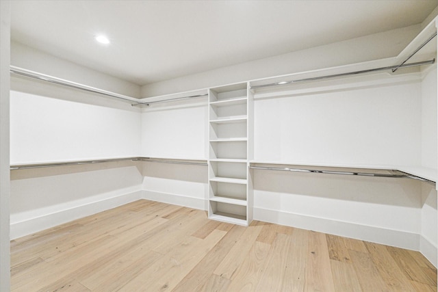 walk in closet featuring light wood finished floors