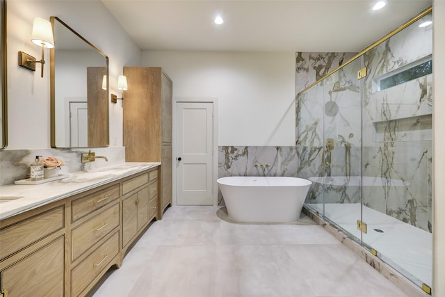 full bath featuring recessed lighting, a marble finish shower, tile walls, a soaking tub, and vanity