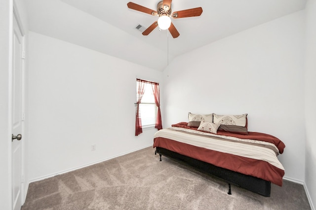 bedroom with carpet floors, visible vents, ceiling fan, and vaulted ceiling