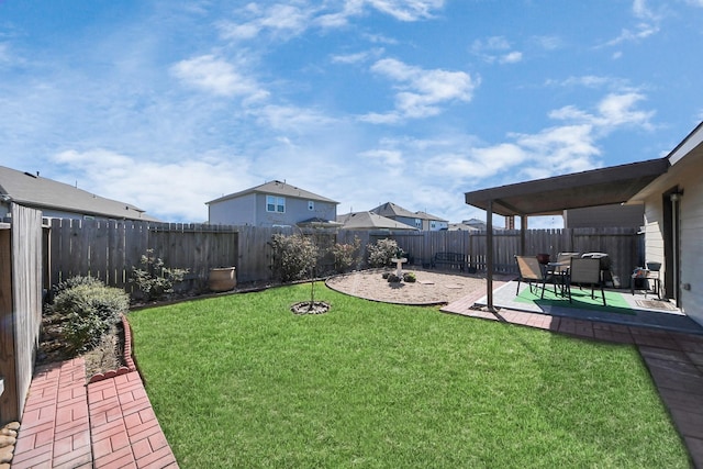 view of yard with a fenced backyard and a patio