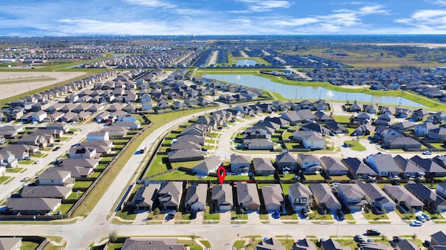 aerial view with a residential view and a water view