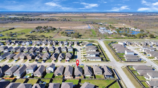 birds eye view of property with a residential view