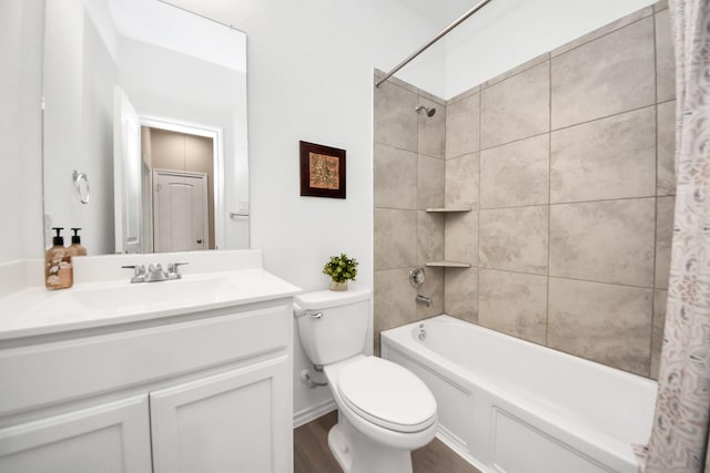 bathroom with vanity, toilet, shower / tub combo, and wood finished floors