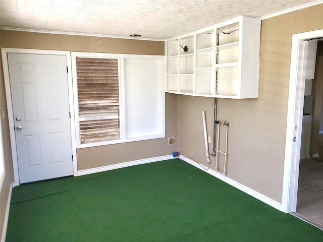 clothes washing area featuring carpet flooring, laundry area, and baseboards