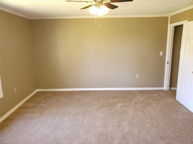 spare room featuring baseboards, carpet, ornamental molding, a textured ceiling, and a ceiling fan