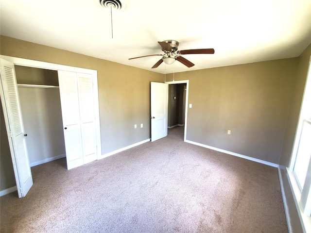 unfurnished bedroom with visible vents, baseboards, ceiling fan, carpet flooring, and a closet