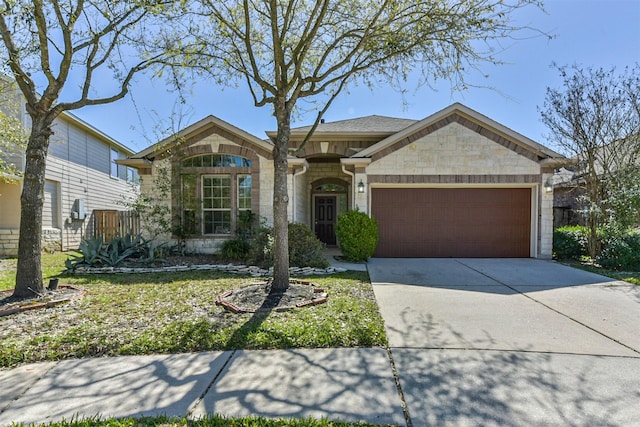 ranch-style home with concrete driveway, an attached garage, fence, and stone siding