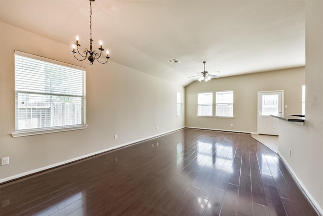 interior space with a wealth of natural light, visible vents, ceiling fan with notable chandelier, and dark wood-style flooring