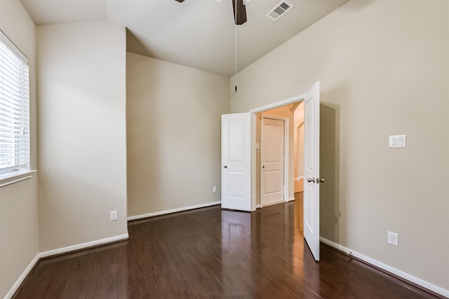 spare room featuring wood finished floors, visible vents, a wealth of natural light, and ceiling fan