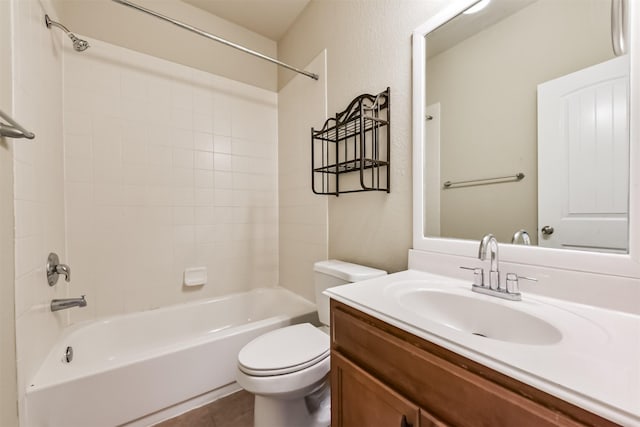 full bathroom featuring toilet, shower / tub combination, a textured wall, tile patterned floors, and vanity