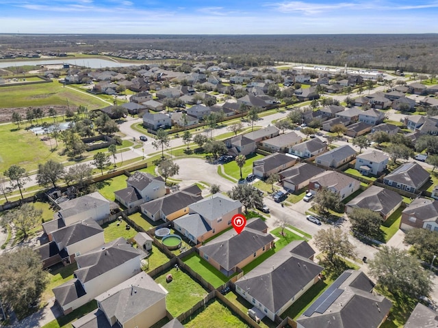 aerial view featuring a residential view and a water view