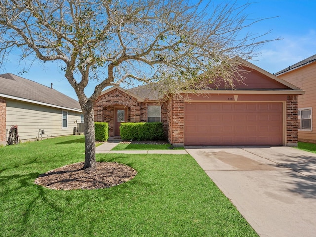 single story home with brick siding, a front lawn, concrete driveway, and a garage