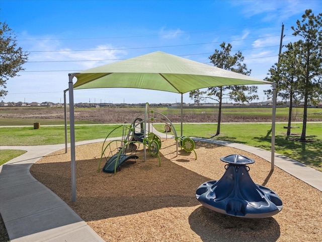 communal playground featuring a yard