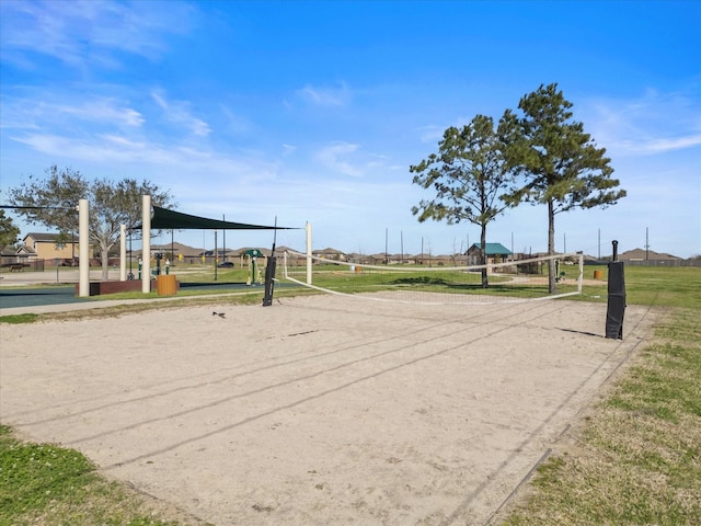 view of home's community featuring volleyball court