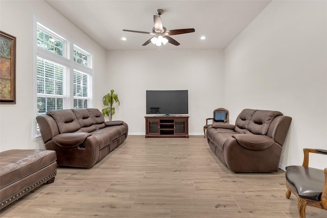 living room featuring recessed lighting, light wood-type flooring, baseboards, and a ceiling fan