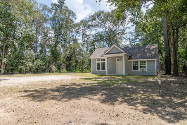 view of front of home featuring roof with shingles