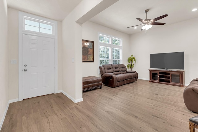 entryway with recessed lighting, light wood-style floors, and baseboards