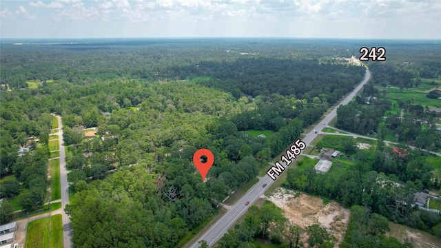 aerial view featuring a wooded view