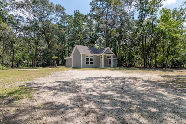 view of property exterior featuring a lawn