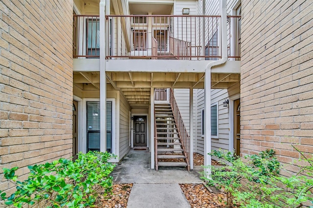 property entrance featuring brick siding