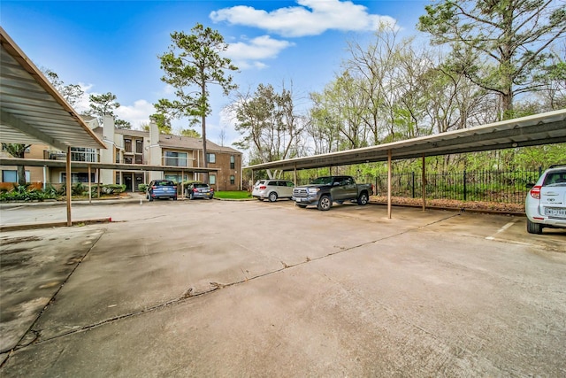 covered parking lot with fence