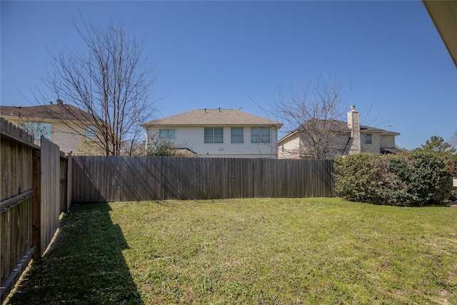 view of yard featuring a fenced backyard