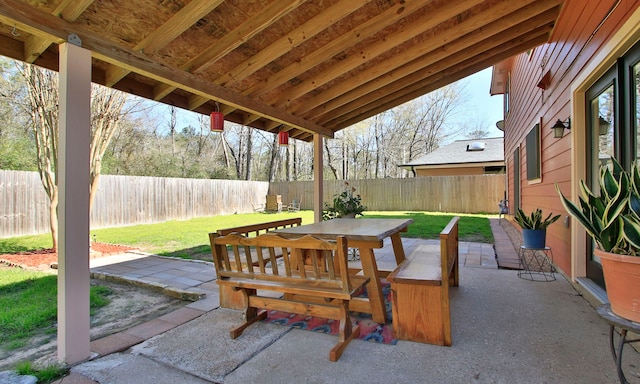 view of patio with outdoor dining area and a fenced backyard