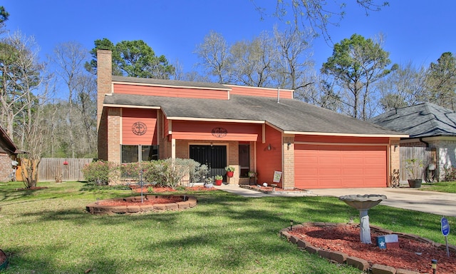 view of front facade featuring concrete driveway, an attached garage, fence, and a front lawn