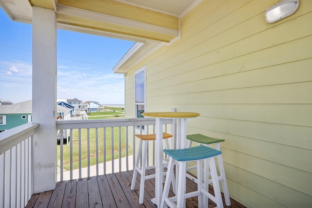 wooden terrace with a residential view