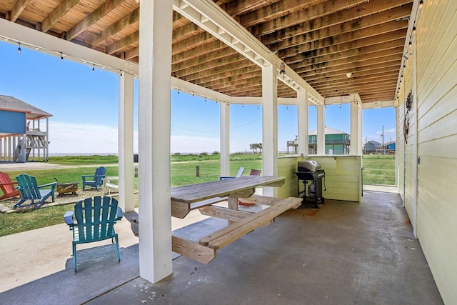 view of patio featuring grilling area and an outdoor fire pit