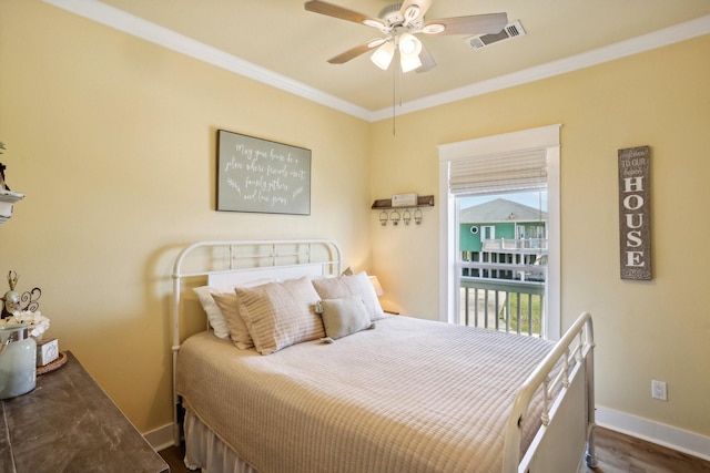 bedroom featuring dark wood-style floors, baseboards, visible vents, ceiling fan, and crown molding