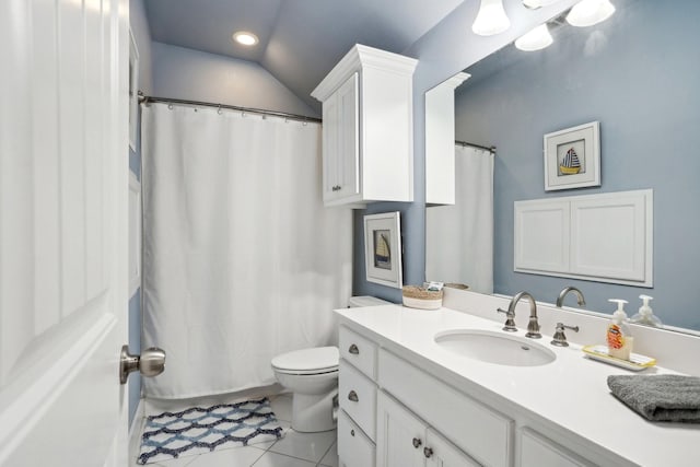 bathroom featuring tile patterned flooring, toilet, a shower with shower curtain, vaulted ceiling, and vanity